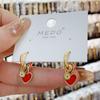 Pendientes de celebridad de Internet con hebilla de oreja de esmalte rojo de amor festivo de Año Nuevo, ligeros y de lujo que combinan con todo, de nicho, de alta gama y coloridos.