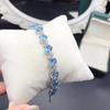 Nueva pulsera plata s925 incrustada topacio azul suizo natural incrustación completa ovalada 5*7mm Joker