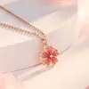 Colar, brincos e anel de flor rotativa da série Suit para feminino, design de nicho de luxo leve, corrente para clavícula, presente para namorada