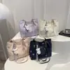 Bolsos tote de nicho populares para mujer de este año, nuevos y elegantes bolsos de hombro para el trabajo de la primavera de 2026, bolsos versátiles de axila