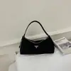 Bolsa feminina de nicho estilo francês 2026 nova moda casual bolsa de ombro de náilon bolsa de mão versátil bolsa transversal