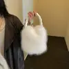 Colección nueva de otoño e invierno transfronteriza: Bolso de mano de color liso, elegante y esponjoso para mujer, que irradia una sensación lujosa y afelpada