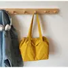 Bolsa de ombro feminina INS 2026 novo modelo bolsa de balde com cordão cor sólida bolsa tote casual de grande capacidade bolsa de mão casual
