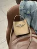 Bolso pequeño tipo cubo de piel de vaca de primera capa para mujer, Bolso de mano de alta gama para el trabajo, Bolso de hombro de piel de vaca Togo, Bolso cruzado para el trabajo
