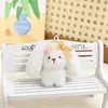 Colgante de conejo de peluche suave y lindo con orejas caídas y lazo de perlas, decoración de juguete para mochilas, accesorio de regalo y suministros para puestos