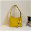 Bolso bandolera de color liso estilo casual vintage para el hombro o la axila, nuevo modelo primavera 2026, bolso cruzado de tendencia simple para trabajadores de oficina