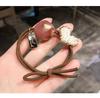 Diadema estilo coreano para mujer, popular en internet, tendón de goma, lazo para mujer, tocado de perlas simple y distintivo, lindo anillo para el cabello, pulsera, cuerda para el cabello de doble uso