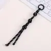 Encanto de bolsa creativo y moderno de nudo de botón, un accesorio de bolsa único y versátil tejido a mano con cuerda de nylon, también adecuado para colgar teléfonos