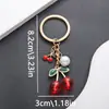 Chaveiro de Cereja Novo Criativo Transfronteiriço Pingente de Chave de Liga com Gotejamento de Óleo Pendente de Bolsa Presentes Venda por Atacado