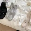 Calcetines estilo ballet para mujer calcetines de color liso con lazo de encaje calcetines de felpa versátiles para primavera y verano calcetines de tubo grises estilo miu