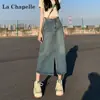 Falda de mezclilla vintage hip para mujer 2025 tendencia versátil nueva primavera y otoño cintura alta línea A abertura longitud media