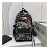 Mochila Escolar para Niños de Primaria Grado Uno Tres a Seis Cuatro Cinco Camuflaje Impermeable Ligera Mochila de Gran Capacidad
