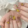 Pedras de strass para manicure douradas, modernas e deslumbrantes, apresentando designs de floco de neve, estrela de cinco pontas e cristal de vidro redondo com base pontiaguda, usadas como acessórios decorativos