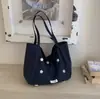 Bolso grande de gran capacidad y ligero para mujer, nuevo modelo de verano 2026, bolso de mano casual de moda para la escuela y el trabajo, bolso de hombro grande