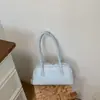 Bolsa de mão popular de nicho coreana, bolsa baguete para mulheres, nova moda de verão 2026, versátil, grande capacidade, bolsa de ombro tipo travesseiro