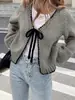 Cardigã de tricô transfronteiriço europeu e americano, novo estilo outono e inverno, com amarração, blusa solta de manga longa cor sólida, jaqueta de moda feminina