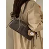 Bolsa Pequena Retro Texturizada de Luxo para Mulheres 2025 Novo Modelo Versátil Bolsa de Ombro para o Dia a Dia Bolsa de Mão Fashion Bolsa Baguette