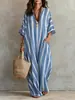 Moda Transfronteriza Europea y Americana para Mujer 2026 Vestido Holgado de Rayas de Venta Caliente con Estampado Plisado, Falda Larga Falsa con Bolsillos, Vestido de Playa