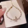 Pulsera de Perlas con Lazo de Perlas Estilo Retro Francés, Lujo Ligero, Gama Alta, Pulsera Exquisita, Joyería de Mano Personalizada y Versátil