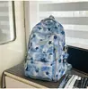 Mochila retro tie-dye con estampado de estrellas rojas y negras, estilo workwear unisex, elegante y genial para adolescentes y estudiantes.