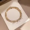 Pulsera trenzada multicapa con incrustaciones de diamantes, transfronteriza europea y americana, con diseño de lujo ligero, estilo nicho, accesorio de mano versátil y elegante para mujer