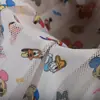 Tecido de poliéster com estampa de desenho animado, proteção solar, confortável, respirável, para roupas esportivas e casuais
