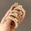 2025 Nuevo Estilo Cuerda para la Cabeza Niña Banda Elástica de Gama Alta Cuerda para el Cabello Anillo para el Cabello Elegante de Gama Alta Cubierta de Cuero Simple Accesorios para el Cabello