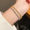 Pulsera con Cierre de Corazón de Circonia Chapada en Oro Real de 18k Pulsera de Lujo Ligero de Alta Gama Estilo Frío Personalidad Joyería de Mano Venta al por Mayor