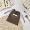 Bolsa de cosméticos con cordón bolsa pequeña de tela para llevar en la mano linda bolsa de pana bolsa organizadora con cordón bolsa de regalo bolsa de almacenamiento para artículos varios