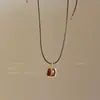 Colar retrátil com pingente de olho de tigre vintage para mulheres, um acessório refinado e luxuoso com um estilo sofisticado e elegante, perfeito para combinar com suéteres