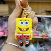 Puesto cantidad de muñeca de PVC linda de moda al por mayor explosión de dibujos animados tridimensionales colgante de bolsa de muñeca escaneo de código regalo