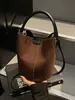 Bolso de mano vintage transfronterizo para mujer, nuevo bolso cubo de nicho de moda 2026, bolso de hombro cruzado elegante y de alta gama