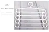 Colgador de pantalones de plástico directo de fábrica, clip multiusos para pantalones, perchero blanco de alta calidad, multicapa para secado en casa, colgador antideslizante para pantalones