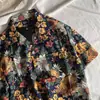 Cuello de solapa 2025 Nueva Camisa Floral para Hombre Estilo Coreano Holgada Moda Estampada Estilo Playa Casual de Manga Corta Comercio Exterior