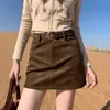 Falda de tiro real otoño invierno 2026 nuevo estilo engrosada gamuza felpa falda de chica hot falda Maillard ajustada a la cadera falda de línea A