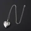 Bestseller transfronterizo acero inoxidable acabado espejo brillante lujo ligero forma de corazón caja de fotos collar que puede contener fotos