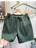Pantalones cortos para hombre, pantalones de longitud media para el verano 2026, marca de moda, transpirables, holgados, finos, pantalones casuales de cintura media para hombre