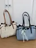 Bolso de mano grande casual de moda estilo coreano para mujer, nuevo modelo de verano 2026, bolso de hombro elegante de alta apariencia para el trabajo