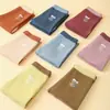 Leggings térmicos para niños otoño e invierno 2026 color caramelo cepillado elástico base leggings para niños y niñas pantalones para dormir en casa
