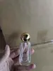 Venta Caliente 50ml Tapa Esférica Fondo Grueso Alta Transparencia Vidrio Botella de Perfume Portátil Dispensador de Muestras de Belleza Botella Vacía con Aerosol Sellada