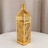 Lámpara de viento de hierro chapado en oro transfronterizo, linterna marroquí hueca, adornos para decoración del hogar, artesanías, candelabros, accesorios de ambiente