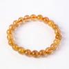 Cristal natural cristal de cabello dorado pulsera de cuentas redondas cristal amarillo mina antigua Brasil hombres y mujeres pulsera de cristal de titanio joyería al por mayor
