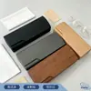 Estuche de cuero con veta de madera de alta gama europeo y americano tipo flip-top con logotipo personalizado, bolsa de almacenamiento portátil para gafas de sol, estuche para gafas transfronterizo