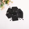 En stock tela imitación lino bolsa de bolsillo de texto pulsera de juego bolsa de embalaje de almacenamiento bolsa de almacenamiento de carga para auriculares bolsa antipolvo para joyas