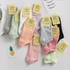 Calcetines invisibles para mujer Zhuji, calcetines de media pantorrilla estilo japonés para primavera y otoño, calcetines holgados de color liso transpirables que absorben el sudor, calcetines para hombre de fábrica al por mayor