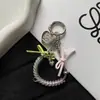 Cadena de hueso de serpiente de cable telefónico nueva y creativa con lazo personalizado, decoración versátil para bolso y accesorio para funda de teléfono