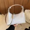 Bolsa de bolinho coreana de nicho transfronteiriça para mulheres, novo modelo 2026, bolsa de ombro e transversal super popular para o dia a dia