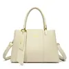 Bolsa de mão transfronteiriça bolsa feminina nova moda costura grande capacidade prática temperamento ombro mensageiro bolsa de mão atacado