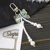 Nuevo Colgante Creativo de Cadena Colgante con Lazo de Perlas para Bolso, Funda de Teléfono, Llavero, Adorno, Exquisito Accesorio de Regalo Pequeño