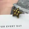 Suministro directo botón metálico de estrella de cinco puntas retro botón pequeño fragancia estilo europeo y americano suéter abrigo abrigo de cuero accesorios de joyería